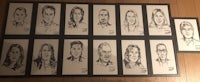 a group of people's faces are drawn on a piece of paper