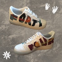 a pair of sneakers with graffiti written on them