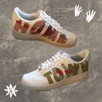 a pair of sneakers with words written on them